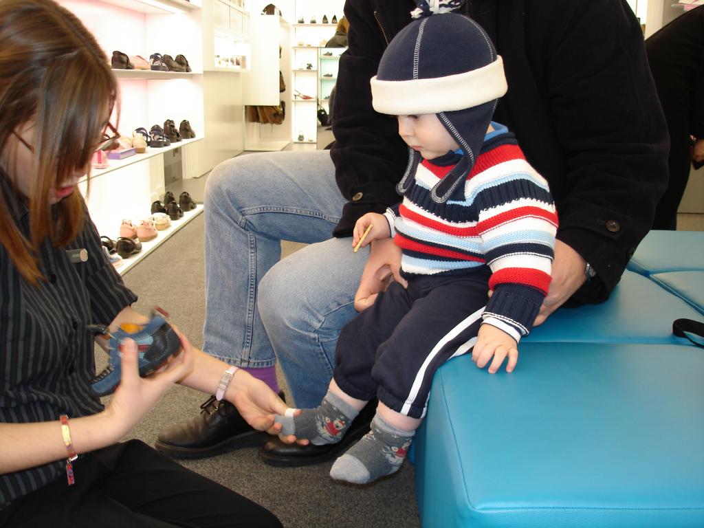 toddler getting new shoes