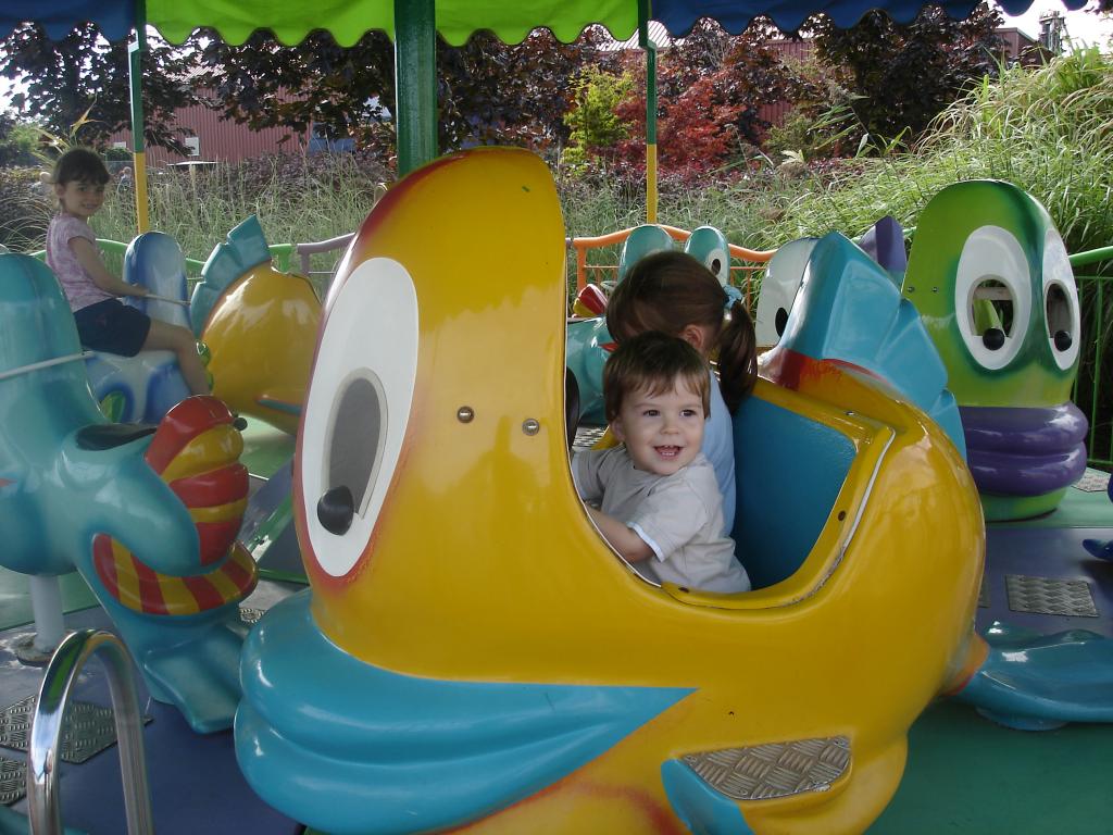 Adam, young, on a kids ride
