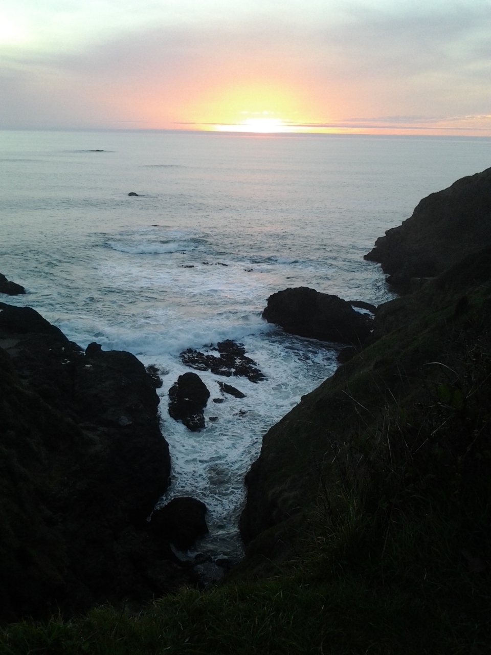  sunset over the pacific, rocks in the foreground