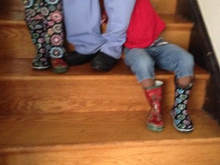children in mismatched rainboots