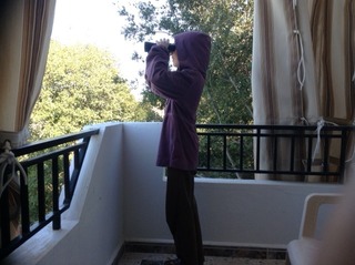 Looking off the balcony with binoculars