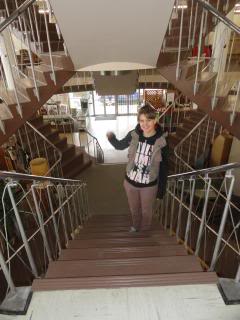 photo of Holly on fancy 1960s stairs