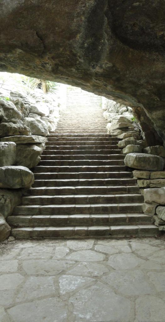 stairs up out of a small cavern