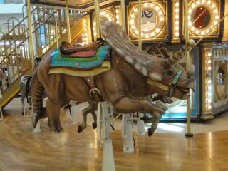 dinosaur to ride on a carousel
